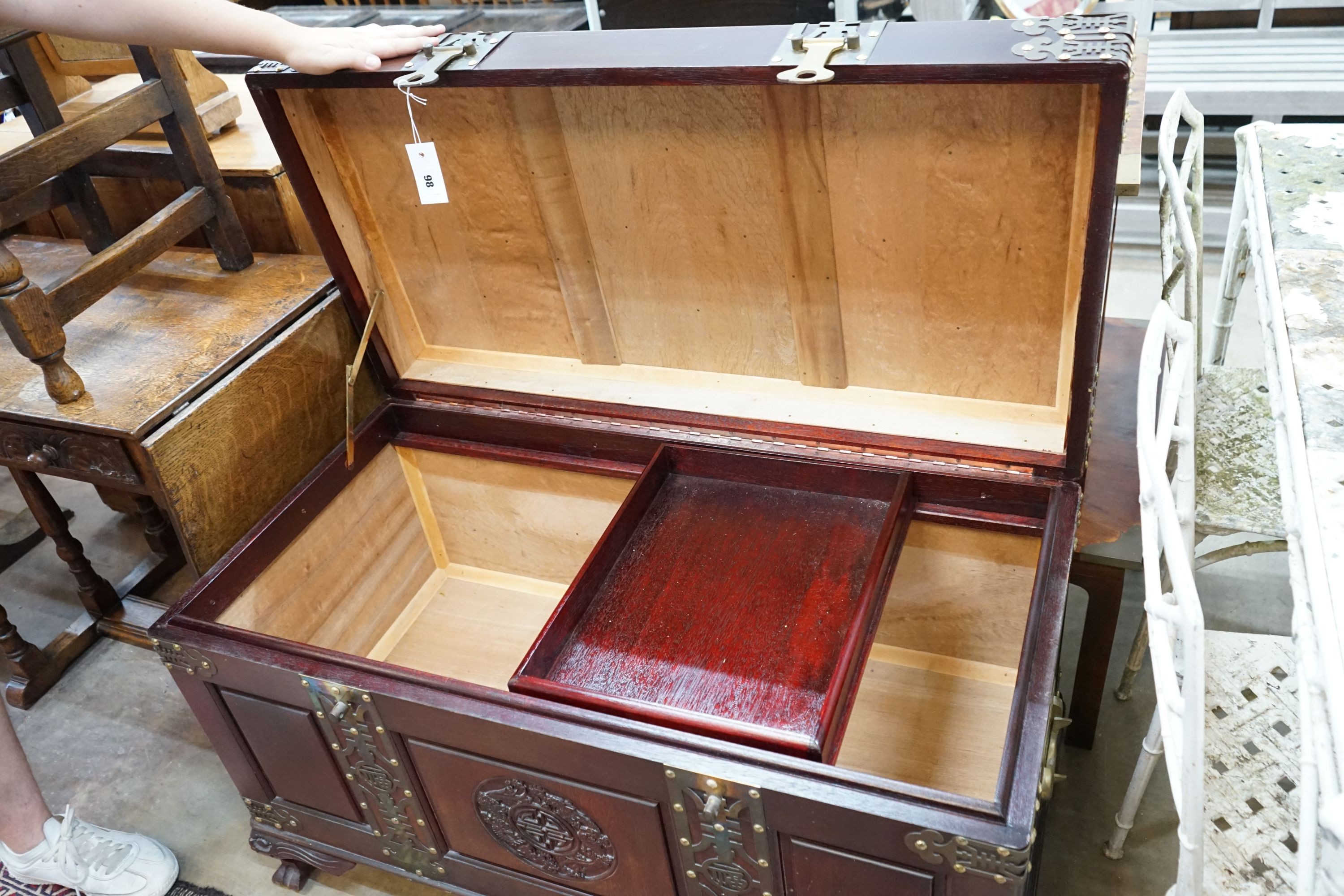 A Chinese brass mounted carved hardwood coffer, length 102cm, depth 52cm, height 63cm